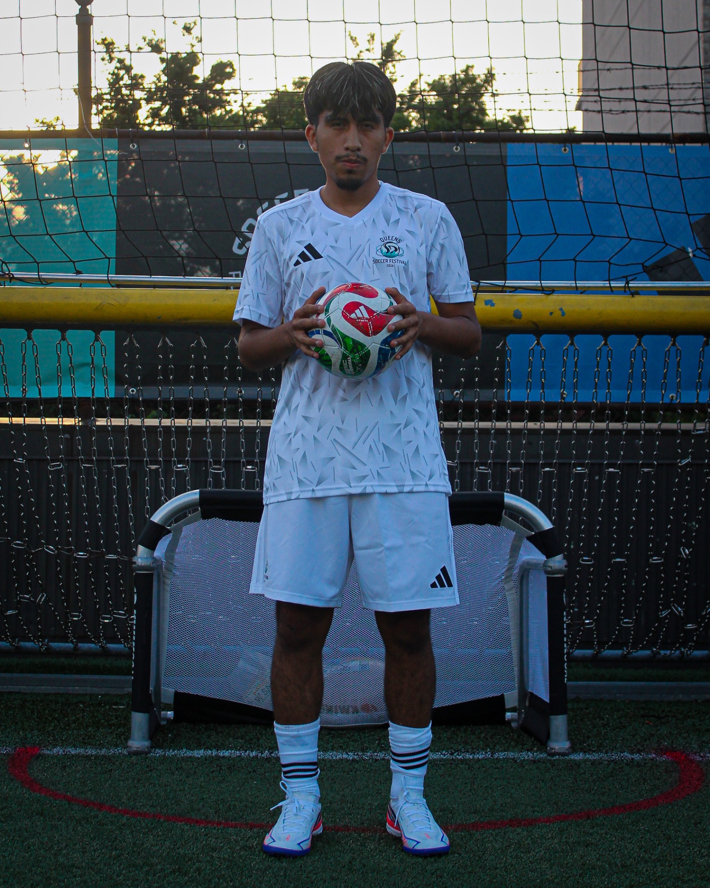 Player portrait in white kit with ball
