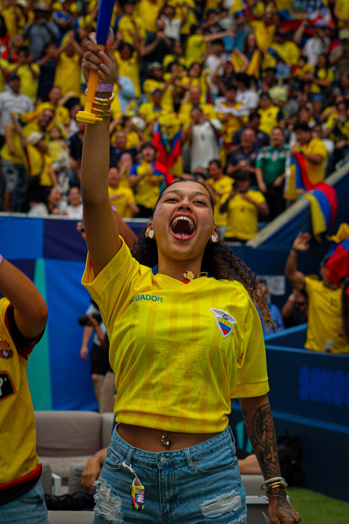 Fan cheering with vuvuzela