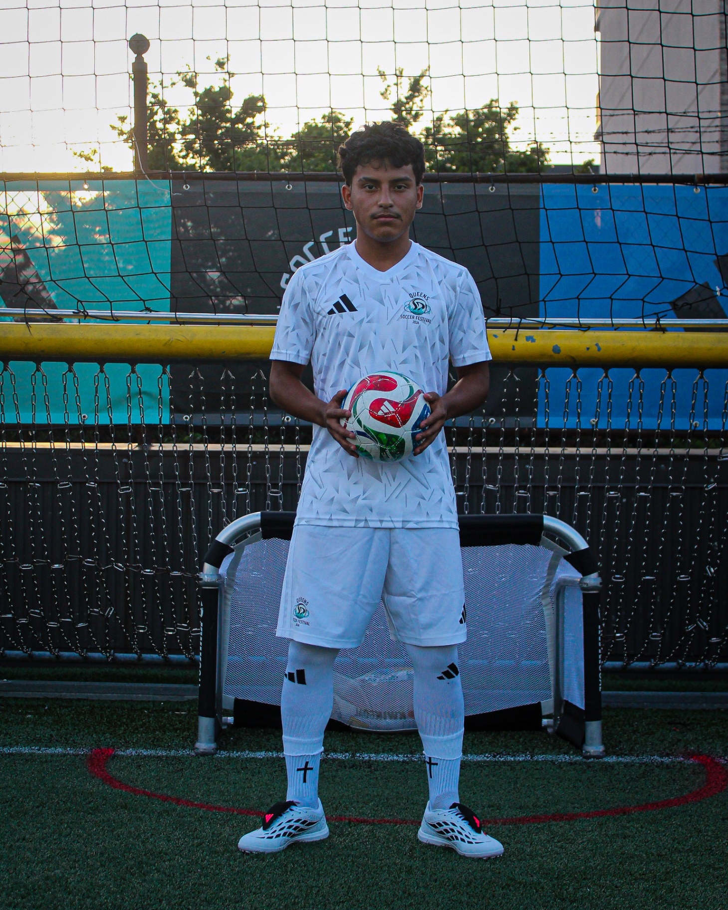 Player portrait holding matchball on turf