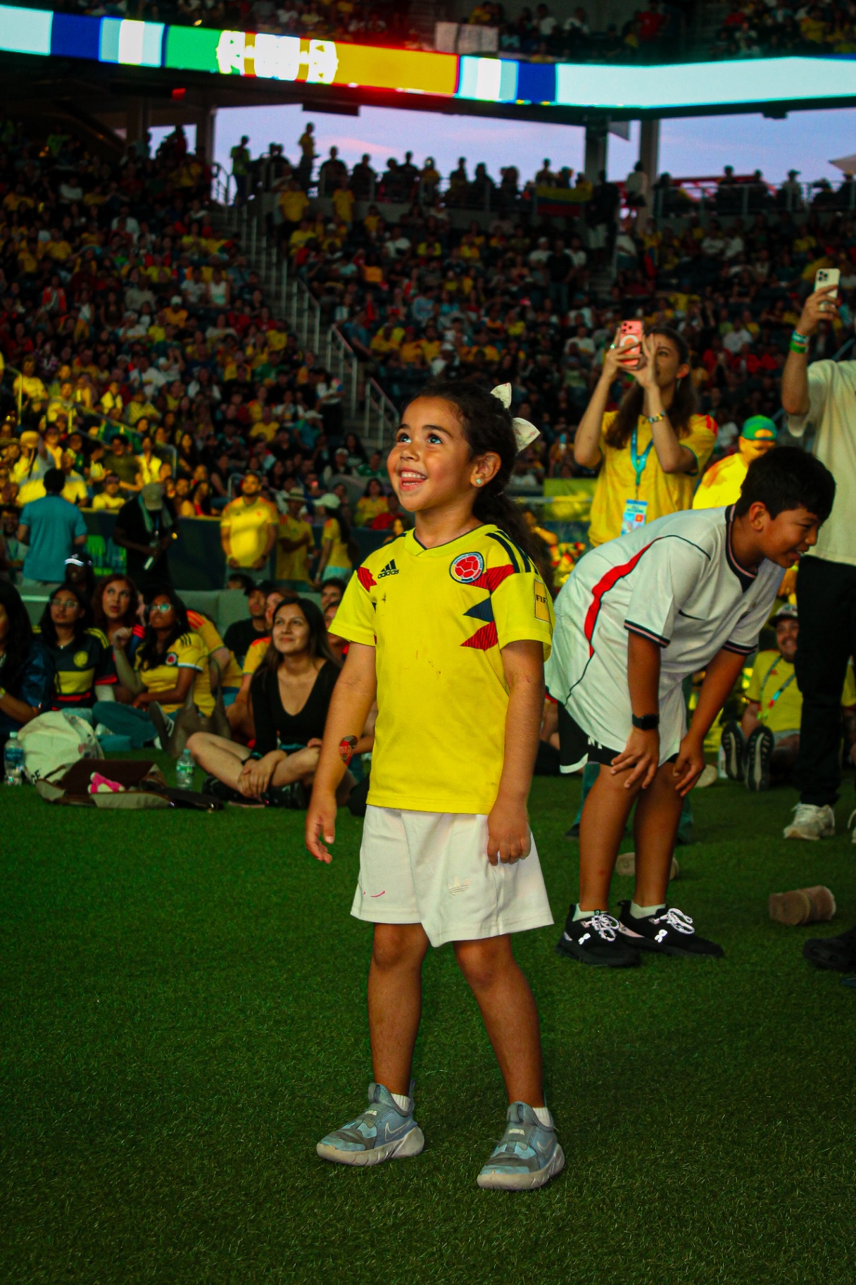 Young fan cheering at the stadium